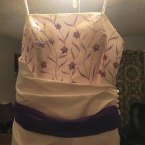 White wedding dress with purple accent.